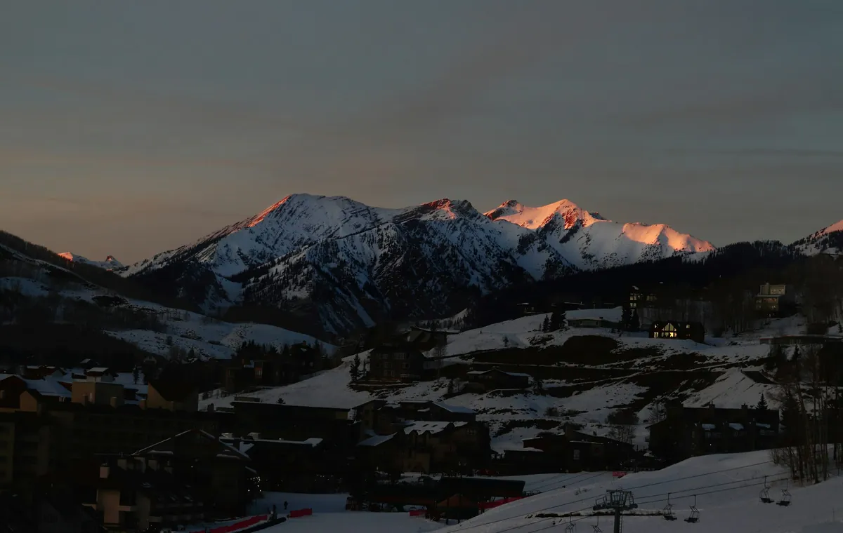 Alpenglow on the peaks above Crested Butte at dusk